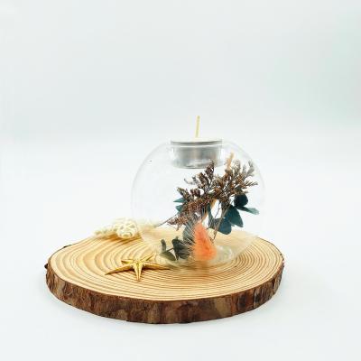 China Home Decoration Clear Glass Candle Holder with Dry Flower and Leaves Hand Made Glass Tea Light Candle Holder for sale