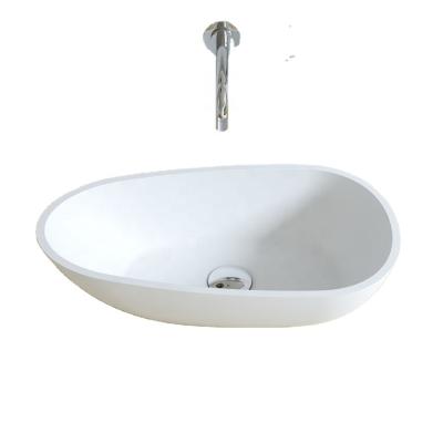 China Modern Artificial Stone Oval Basin Toilet Room Rug Wash Sink Solid Outdoor Bathroom Sink for sale