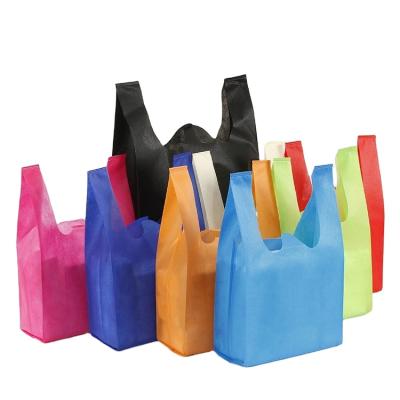 China Eco-friendly Cheap Reusable W Cut Non Woven Supermarket Tote Grocery Shopping Carry Bag T-shirt Vest for sale