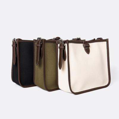 China Fashion Large Capacity Brown Canvas Flip Buckle Messenger Bags With Interior Insert Pocket Stylish Cross - Body Bags for sale