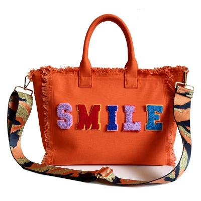 China PORTABLE Logo Tassel Fringe Large Canvas Bag Summer PORTABLE Customized Bags For Women Beach Tote Bag Custom for sale