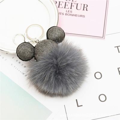 China Lovely 8cm Real Mickey Fox Fur Pom Pom Plush Genuine Leather Luxury Fluffy Ball Key Chain Metal Key Ring Pendant Bag Charm for sale