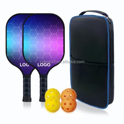 China Carbon Fiber+PP Customized Graphic Pickleball Paddle Set Wholesale Set Of 2 Carbon Fiber Pickleball Rackets With 4pcs Balls And 1pc Bag for sale