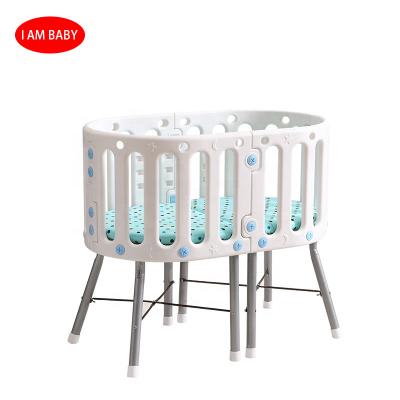 China Modern Multifunctional Kids Beds Crib Baby Kids Detachable Table and Chair Oval Crib for sale