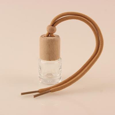 China Factory Small Glass Round Cylindrical Car Freshener Hanging Car Hanging Perfume Bottle for sale