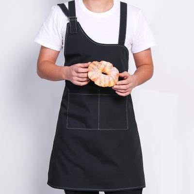 China Fashion Cleaning Apron for Women Men Adjustable Strap Canvas Cotton Cooking Chef Waterproof Hairstylist Bib Apron with 2 Pockets for sale