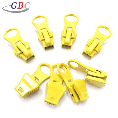 China Other 5# Resin Almond Slice Auto Key Zipper Slider For Luggage Bags for sale