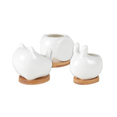 China Traditional high quality pure white design unique best selling ceramic flower pot for sale