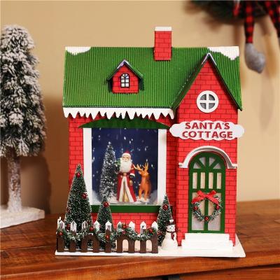 China Plastic Music House With Snow Falling Santa Cottage With Light Operated Christmas Snowfall House With Music for sale