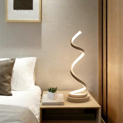 China Modern Single Grain Wrought Iron Desk LED Line Art Led Modern Table Lamp for sale