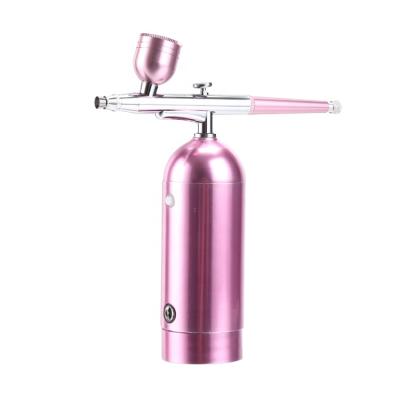 China Nail Makeup Cake Air Brush Kit Cordless Spray Airbrush Facial Compressor For Barber Shop 44*126mm for sale