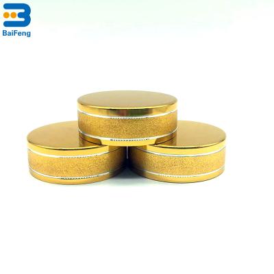 China Non Spill Hot Sale 38mm Sand Rolling Aluminum Bottle Cap For PET Bottle for sale