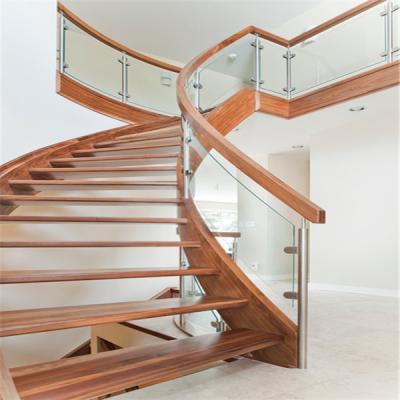 China Modern Double Curved Staircase With Steel Bar Post Railing for sale