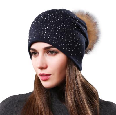 China New COMMON Winter Wool Warm Drilling Blend Knit Hat European Raccoon Fur Ball Covers Outdoor Warm Hats For Ladies for sale