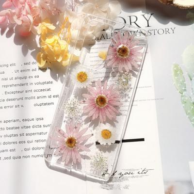 China Custom one piece shockproof silicon epoxy craft cell phone bags and cases with unique real dry flower for iphone pro max x/6/7 phone case for sale