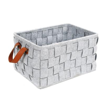 China Traditional Felt Storage Bag With Leather Handles Laundry Storage Bin Felt Strip Material Woven Storage Basket for sale