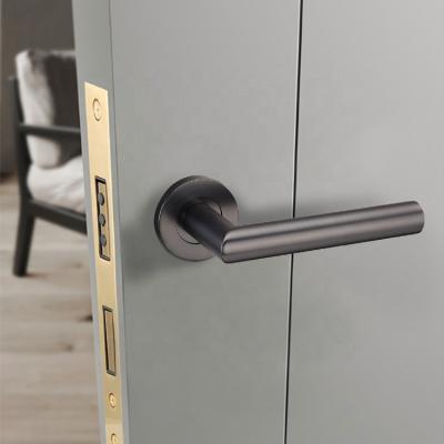 China Modern Sleek Bronze Brass Spring Lever Handle Pvd Gunmetal Stainless Steel Internal Reversible Two Way Lever Handle for sale