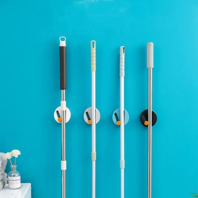 China Plastic Broom Holder Clip Broom Holder Multifunction Nordic Style Simply Wall Mounted Broom Holder for sale