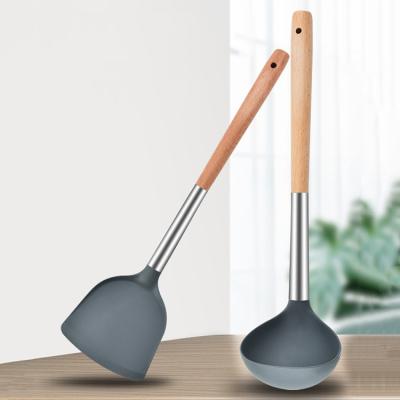 China High performance beech handle silicone shovel soup spoon cozinh silicone cookware viable kitchen utensils for sale