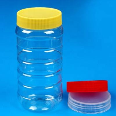 China Plastic Candy 750ml Pet Honey Jar With Handle Screw Top Lid For Canned Food Packaging for sale