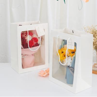 China Recycled Materials Shape Clear Window With Transparent PVC Window Gift Flower Paper Bag for sale