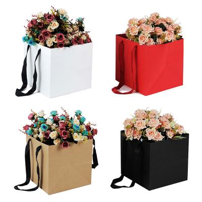 China Popular Materials Hot Selling Reused Flower Square Bottom Kraft Logo Gift Custom Paper Bags for sale