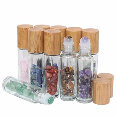 China Personal Care 10ml Roll On Bottle For Essential Oils Clear Roller Glass Bottles With Bamboo Lids Natural Crystal Gemstone Roller Balls Top for sale