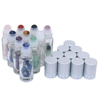 China Personal Care 5ml Gemstone Rollball Bottles Clear Glass Roll Bottles Crystal Chips Inside Essential Oils Roll On Bottles for sale