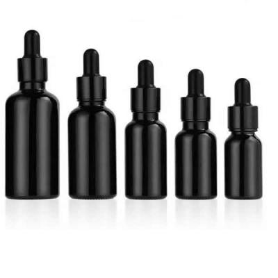 China 30ML Perfume Bottle Cosmetic Custom Amber Glass Dropper Bottles Glass Roll On Bottle With Black Caps for sale