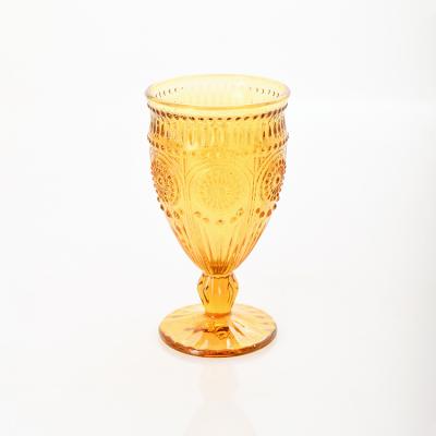 China 2022 New Luxury Transport New Arrival Hand Pressed Colors Wine Sunflower Embossed Glass Goblet for sale