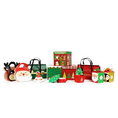 China Recyclable Christmas Children's Set Red Christmas Eve Gift Box Santa Candy Apple Cookie Wrapping Paper Christmas Boxes Packaging for sale