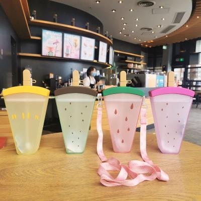 China 2022 Viable Cute INS Girl Mugs With Lids And Purse Plastic Lanyard Straw Popsicle Drink Kids Cold Water Bottles for sale