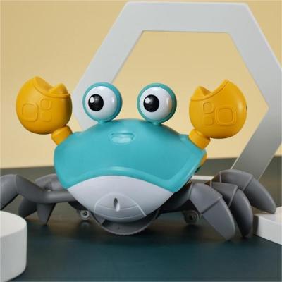 China Baby Sounding Cute Electric Interactive Walking Mobile The Induction Dancing Runaway Crab Infant Animal Sensing Crawling Toy With Music for sale