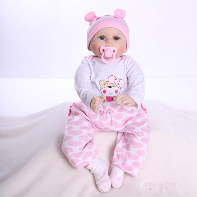 China Soft Toy 22 Inch Reborn Bear Pattern Silicone Dolls Dress Up Girl Christmas Toys For Children for sale