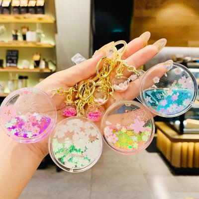 China New Cherry Blossoms Keychain Acrylic Moving Decoration Quicksand Flower Bottle Liquid Keychain For Women Girl Bag Charm Key Chains Gifts for sale