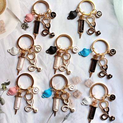 China New Eco Friendly Doctor Keychain Medical Tool Key Chain Ring Injection Syringe Stethoscope Nurse DIY Gift Medical Jewelry Handmade for sale