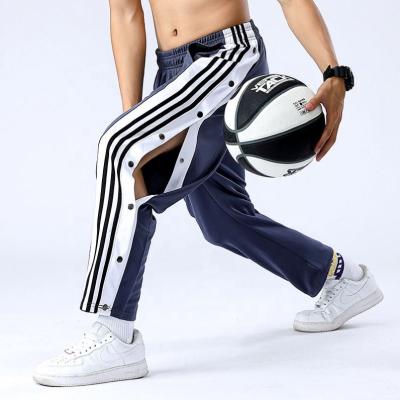 China Anti-Wrinkle Exercise Pants Men's Casual Basketball Training Row Wide Open Button Spring And Loose Side Button Fall Pants for sale