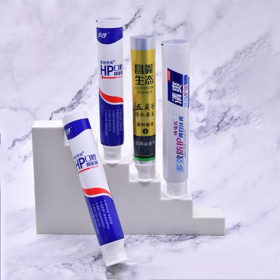 China Custom Empty Soft Collapsible Aluminum Plastic Laminate Tube Cosmetic Packaging 100g ABL Toothpaste Tube for sale