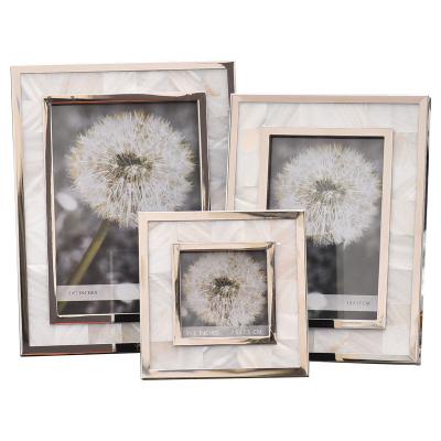 China Modern Minimalist Light Luxury Metal Picture Frame Set Personalized Desk Wedding Photo Shell 3 Inch/6 Inch/7 Inch for sale