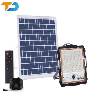 China Garden Tecdeft Outdoor CCTV camera TF card 128G safety IP65 Night vision solar led flood light camera for sale