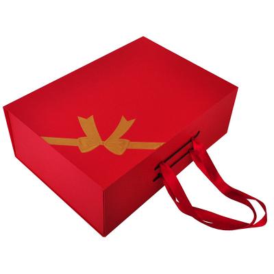 China Handmade Red Custom Cardboard Shoe Boxes Clothing Package Magnetic Eco Friendly Folding Paper Ribbon Folding Box for sale