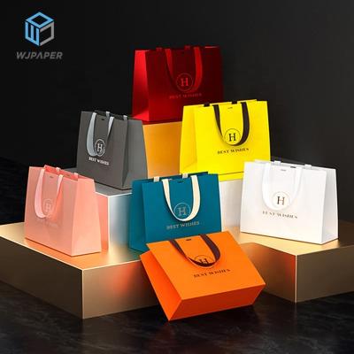 China Wholesale Disposable Custom Printed Logo Luxury White Paper Bag boutique shopping gift retail paper bags with your own logo for sale