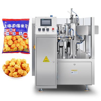 China Food Automatic Snack Premade Bag Packing Machine Snack Food Puffed Granular Chips Popcorn Filling Packing Machine with Nitrogen for sale