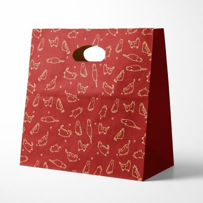 China Recyclable Holiday Party Favor Candy Gift Wrapping Bags Fashion Printing Red Christmas Paper Gift Treat Bag With Die Cut Handle for sale