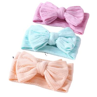 China European and American hot sale children's jacquard jacquard baby headwear CIA style nylon bow headband with wide edge overlayer knotted headband for sale