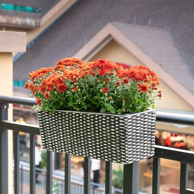 China Contemporary Rattan Pot Wall Decorative Plant Automatic Self Irrigation Self Watering Hanging Plastic Flower Pot for sale