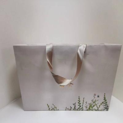 China Recyclable Custom luxury gift clothing paper shopping bags with logo printing and food paper bags for sale