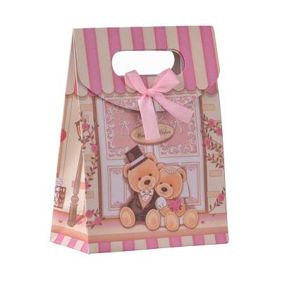 China Luxury Recycled Materials Bags With Logos Die Cut Paper Bag For Gift With Logo Candy Party Gift Wrapping Paper Bag With Die Cut Handle for sale