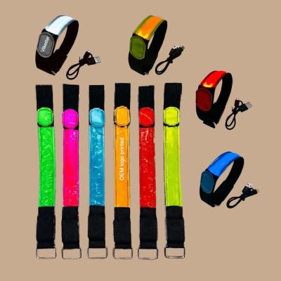 China Fast flash custom logo printed concert party rechargeable snap on nylon led glowing wristband bracelet for sale