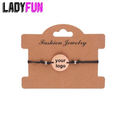 China TRENDY Stainless Steel Custom Round Charms Bracelet Engraved Your Photo Name Letter Tags Adjustable Rope Couple Bracelets Free Design for sale